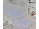 Open-concept living space with hardwood floors, dining table, and modern light fixture at 1110 Waterview E Blvd, Lakeland, FL 33801