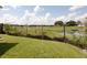 Scenic backyard view of the lake and green grass at 1206 Skyview Cv, Lakeland, FL 33801