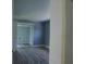 Bedroom with mirrored closet doors and wood floors at 1206 Skyview Cv, Lakeland, FL 33801