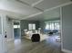 Living room featuring light gray walls, wood flooring, modern furniture, and an enclosed porch area at 1206 Skyview Cv, Lakeland, FL 33801