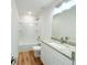 Well-lit bathroom featuring a vanity with granite countertop and a shower over tub combination at 222 Carpenters Way # 71, Lakeland, FL 33805