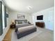 Comfortable bedroom features a large bed, ambient lighting, and modern decor for a serene retreat at 222 Carpenters Way # 71, Lakeland, FL 33805