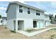 New construction townhome showing gray siding, a modern design, and sidewalk entrance at 222 Carpenters Way # 71, Lakeland, FL 33805