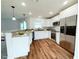 Modern kitchen features stainless steel appliances, white cabinets, and a breakfast bar at 222 Carpenters Way # 71, Lakeland, FL 33805