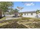 Large backyard with a patio area perfect for outdoor gatherings and relaxation at 2800 E Anderson St, Orlando, FL 32803