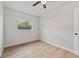 Bright bedroom with wood flooring, ceiling fan and a large window at 2800 E Anderson St, Orlando, FL 32803