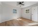 Bright bedroom with wood flooring, ceiling fan, and two windows with lots of sunlight at 2800 E Anderson St, Orlando, FL 32803