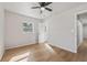 Bright bedroom with wood flooring, ceiling fan, and an open door at 2800 E Anderson St, Orlando, FL 32803