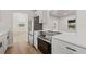 Well-lit kitchen with modern appliances, quartz countertops, and an open floor plan at 2800 E Anderson St, Orlando, FL 32803