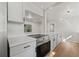 Modern kitchen featuring new stainless steel oven, white cabinets, and quartz countertops at 2800 E Anderson St, Orlando, FL 32803