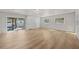 Spacious living room with wood flooring, sliding glass doors, and ample natural light at 2800 E Anderson St, Orlando, FL 32803