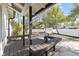 Covered patio features a built-in table and benches for outdoor dining and entertaining at 2800 E Anderson St, Orlando, FL 32803