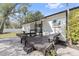 Covered patio features a built-in table and benches, with sliding door access to the home at 2800 E Anderson St, Orlando, FL 32803