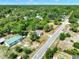Aerial view of a home nestled among lush trees and greenery in a quiet neighborhood at 28712 Azalea Ave, Paisley, FL 32767