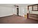 Spacious living room featuring ceiling fan, heater, and access to the bathroom at 28712 Azalea Ave, Paisley, FL 32767