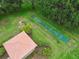 Overhead shot of a shuffleboard court and covered picnic area surrounded by lush greenery at 7991 Lake James Blvd, Lakeland, FL 33810