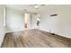 Large bedroom with hardwood floors, modern ceiling fan, and doors leading to other rooms at 7991 Lake James Blvd, Lakeland, FL 33810