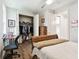 Inviting bedroom featuring neutral decor, wood flooring, and a well sized closet at 7991 Lake James Blvd, Lakeland, FL 33810