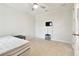 Minimalist bedroom with a TV and small table at 7991 Lake James Blvd, Lakeland, FL 33810