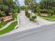 Scenic community entrance featuring brick pillars, lush landscaping, and the welcoming 'Lake James' sign at 7991 Lake James Blvd, Lakeland, FL 33810