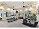 Well-equipped gym with treadmills, elliptical machine, and free weights for convenient resident workouts at 7991 Lake James Blvd, Lakeland, FL 33810