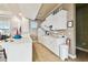 Well-equipped kitchenette featuring white cabinetry, modern appliances, and a functional layout at 7991 Lake James Blvd, Lakeland, FL 33810