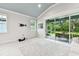 Bright open living area with recessed lighting, a sliding glass door, and access to the outdoor space at 7991 Lake James Blvd, Lakeland, FL 33810