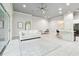 Open-concept living area with tile flooring, recessed lighting, and a seamless flow to the dining and kitchen areas at 7991 Lake James Blvd, Lakeland, FL 33810