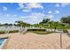 Inviting patio area overlooking a scenic pond, complete with a lounge chair and lush landscaping at 7991 Lake James Blvd, Lakeland, FL 33810