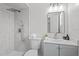 Modern bathroom featuring a shower with gray tile, a vanity and a mirrored medicine cabinet at 9413 5Th Ave, Orlando, FL 32824
