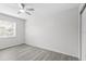 Serene bedroom with a ceiling fan, large window, and modern gray flooring at 9413 5Th Ave, Orlando, FL 32824