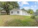 Charming single story home with white paint and green grass at 9413 5Th Ave, Orlando, FL 32824