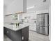 Beautiful kitchen with stainless steel refrigerator and updated cabinets and countertops at 9413 5Th Ave, Orlando, FL 32824