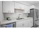 Modern kitchen showcasing stainless steel appliances, quartz countertops, and ample cabinet space at 9413 5Th Ave, Orlando, FL 32824