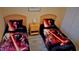 Nicely decorated bedroom offering two twin beds, wood nightstand and Star Wars themed bedding at 189 Minniehaha Cir, Haines City, FL 33844