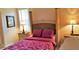 Inviting primary bedroom with a king-size bed and neutral colors at 189 Minniehaha Cir, Haines City, FL 33844