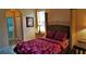 Comfortable primary bedroom with a king-size bed and calming decor at 189 Minniehaha Cir, Haines City, FL 33844