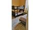Bedroom with full and twin bunk beds with matching patterned bedding and a side table at 189 Minniehaha Cir, Haines City, FL 33844