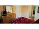 Bedroom with ensuite bathroom featuring double sinks and walk-in closet at 189 Minniehaha Cir, Haines City, FL 33844