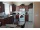 Spacious kitchen with dark cabinetry, stainless steel appliances, and tile flooring at 189 Minniehaha Cir, Haines City, FL 33844