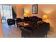 Comfortable living room with wood-look floors and sliding door to patio at 189 Minniehaha Cir, Haines City, FL 33844