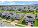 Aerial view of the home showcasing the property's setting in a well-maintained neighborhood at 2296 Crossbow St, Clermont, FL 34715
