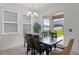 Dining area with sliding glass door, natural light, and view of the backyard at 2296 Crossbow St, Clermont, FL 34715