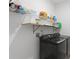 Modern laundry room with new washer and dryer and built in shelves at 2296 Crossbow St, Clermont, FL 34715