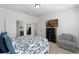 Main bedroom with TV, walk-in closet, en-suite bathroom, and sitting chair at 2296 Crossbow St, Clermont, FL 34715