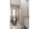Neutral bathroom with tile floors, granite vanity, and a shower with a tan curtain at 2912 Fletcher Ave, Lakeland, FL 33803