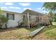 Charming single-story home featuring a spacious wooden deck perfect for outdoor gatherings, and a well maintained exterior at 2912 Fletcher Ave, Lakeland, FL 33803