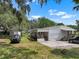 Residential house with front porch and shed in backyard at 2912 Fletcher Ave, Lakeland, FL 33803