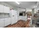 Modern kitchen with stainless steel appliances, wood flooring, and ample cabinet space, featuring an open layout at 2912 Fletcher Ave, Lakeland, FL 33803