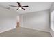 Bedroom with neutral carpet, and entrance to the bathroom at 4217 Kingbird Ct, Orlando, FL 32826